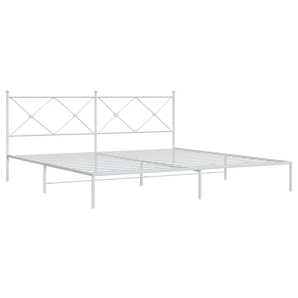 White metal bed frame with diamond pattern headboard and grey bedding