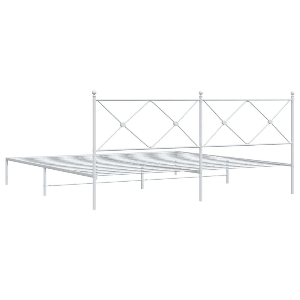 White metal bed frame with a decorative headboard and slatted base