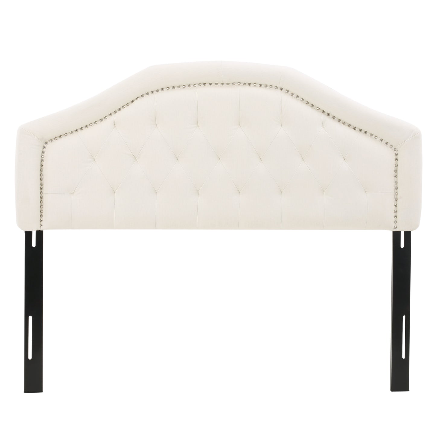 Cream upholstered curved headboard with diamond tufting and silver nailhead trim