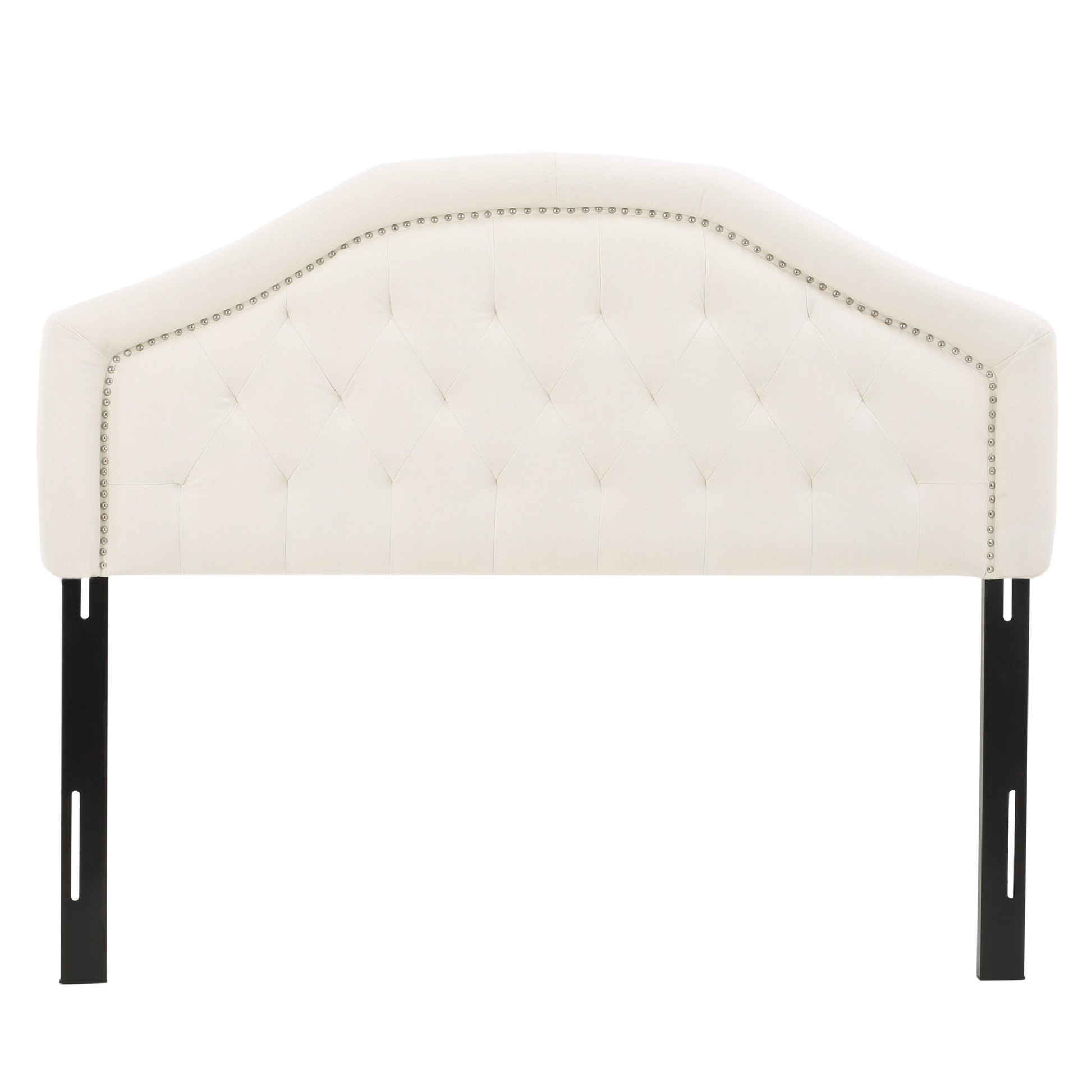 Cream upholstered curved headboard with diamond tufting and silver nailhead trim