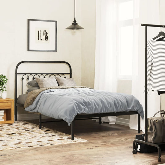 Black metal twin bed frame with curved headboard and decorative finials