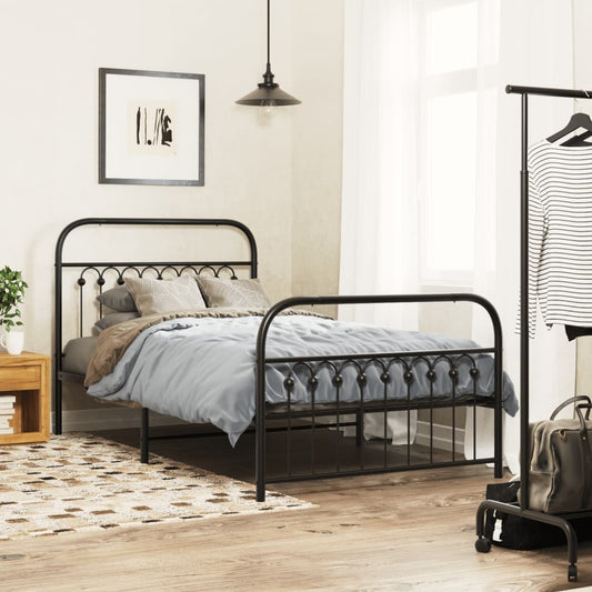 Black metal bed frame with arched headboard and footboard featuring decorative finials
