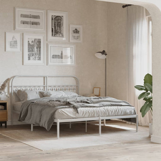 White metal bed frame with decorative headboard and footboard