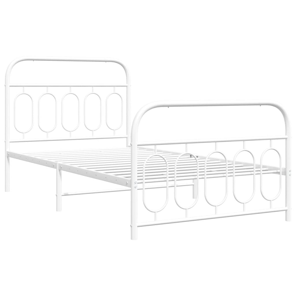 White metal frame bed with oval detailing and blue bedding