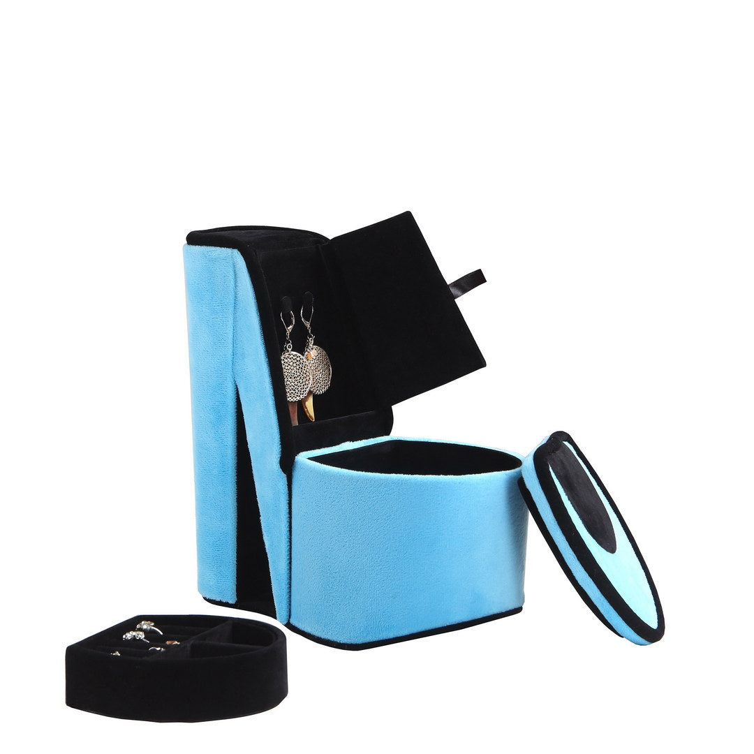 Blue velvet jewelry box with earrings and rings