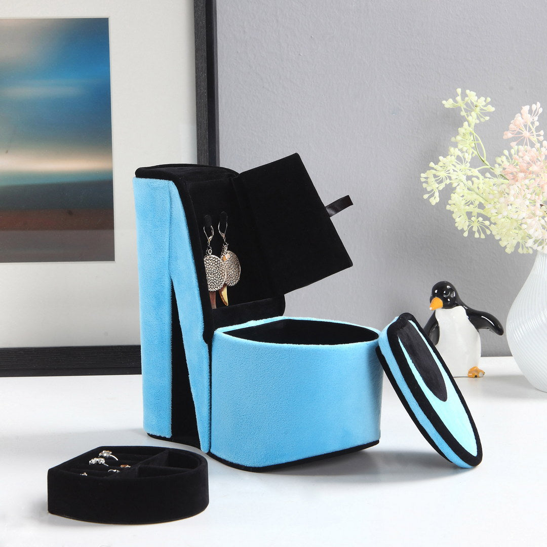Blue velvet jewelry organizer with earrings and rings