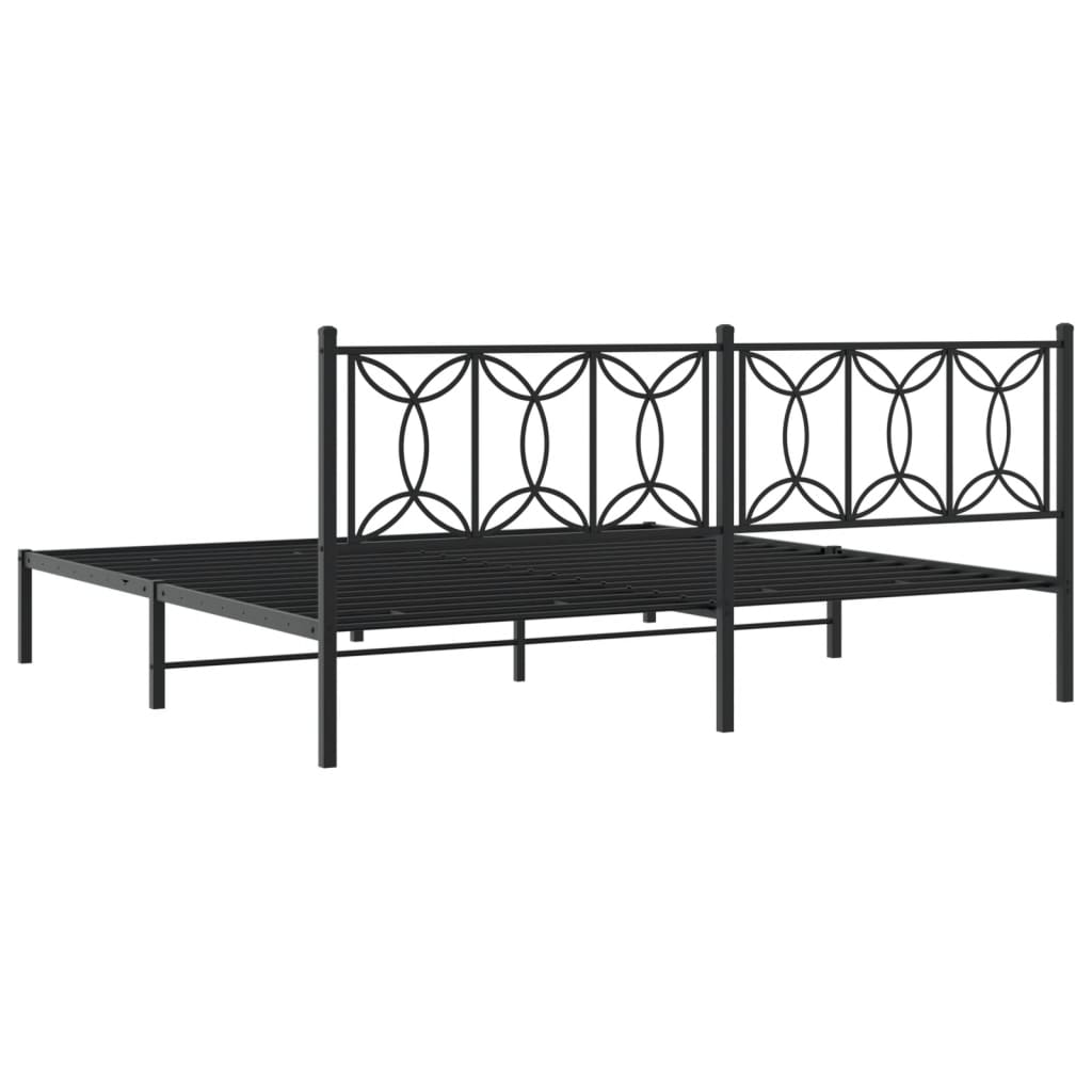 Black metal bed frame with an ornate headboard side view