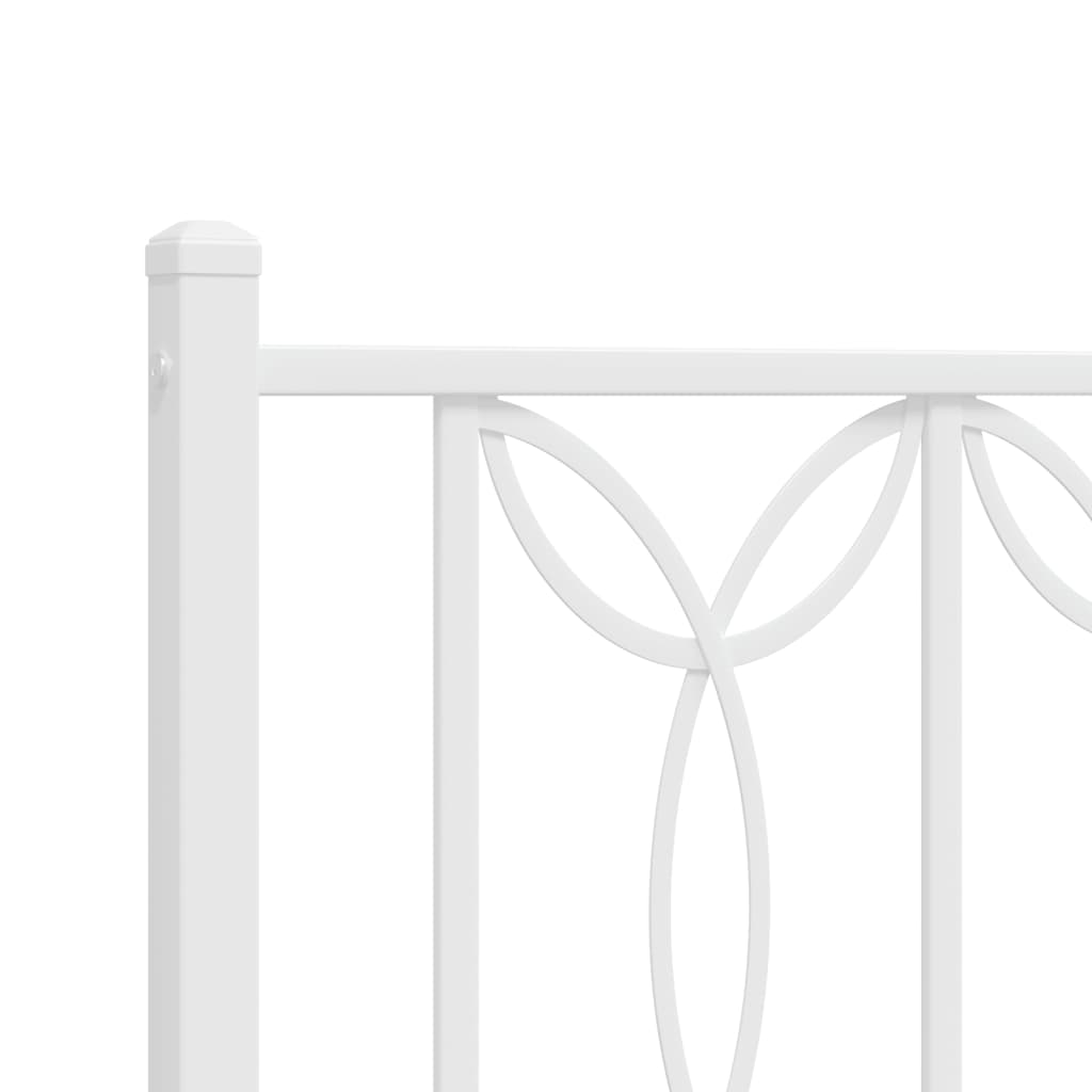 White metal bed frame with decorative headboard and footboard