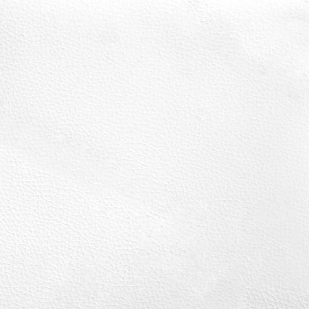 Closeup of white tufted headboard with a smooth fabric finish
