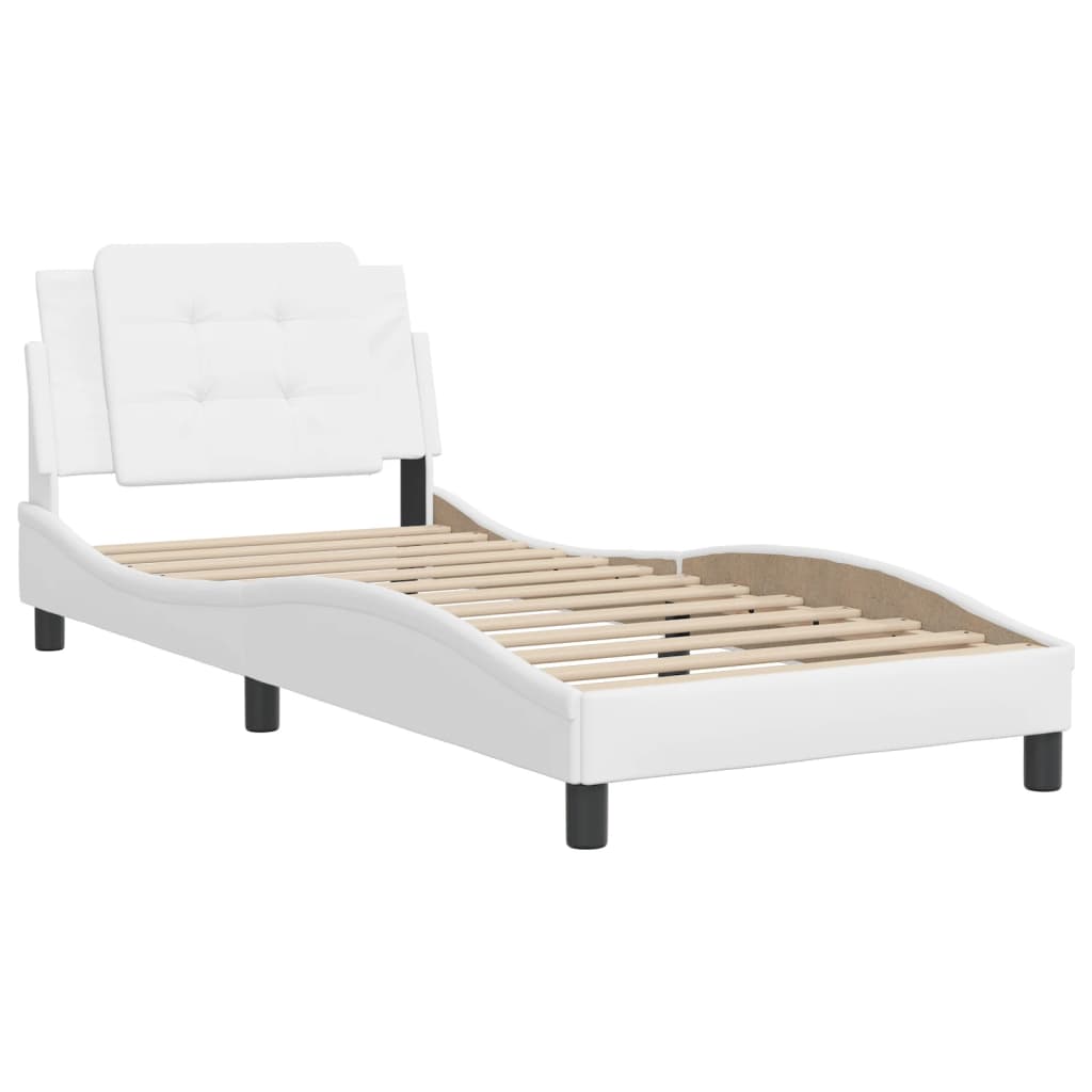 White faux leather chaise lounge with tufted headboard