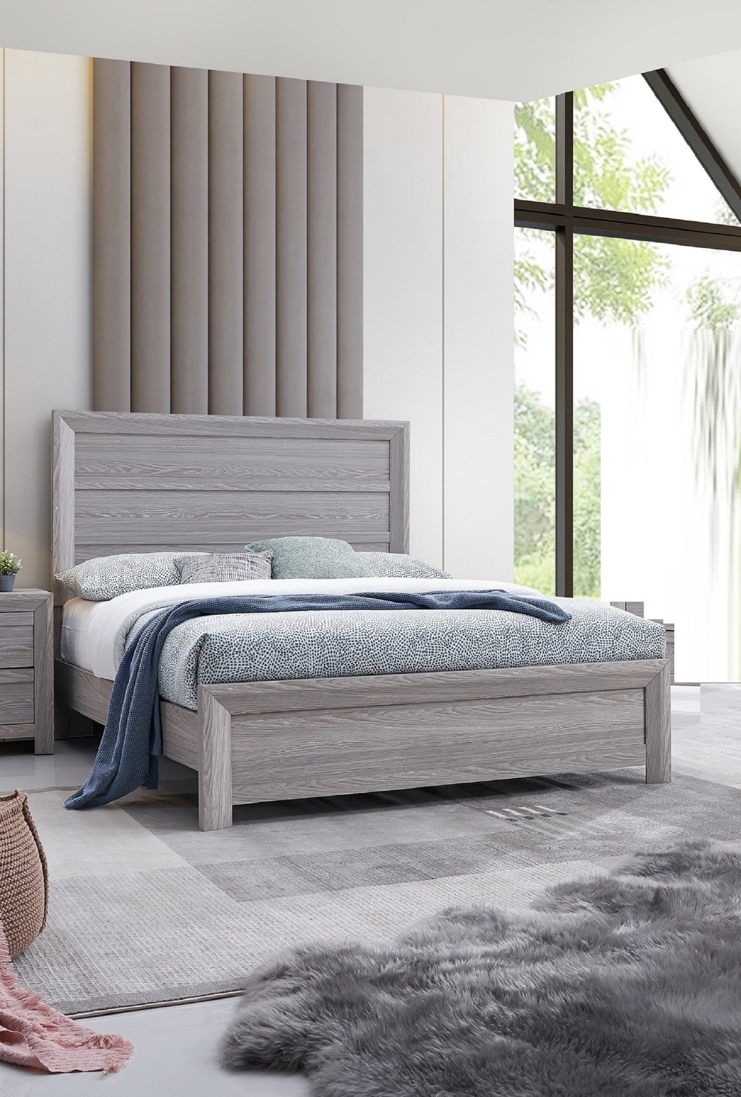 Grey wooden platform bed with blue and white patterned bedding