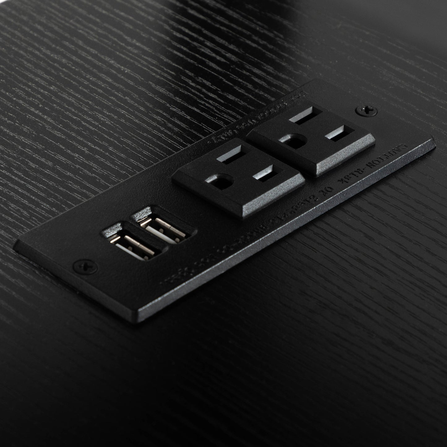 Black power strip with two outlets and two USB ports