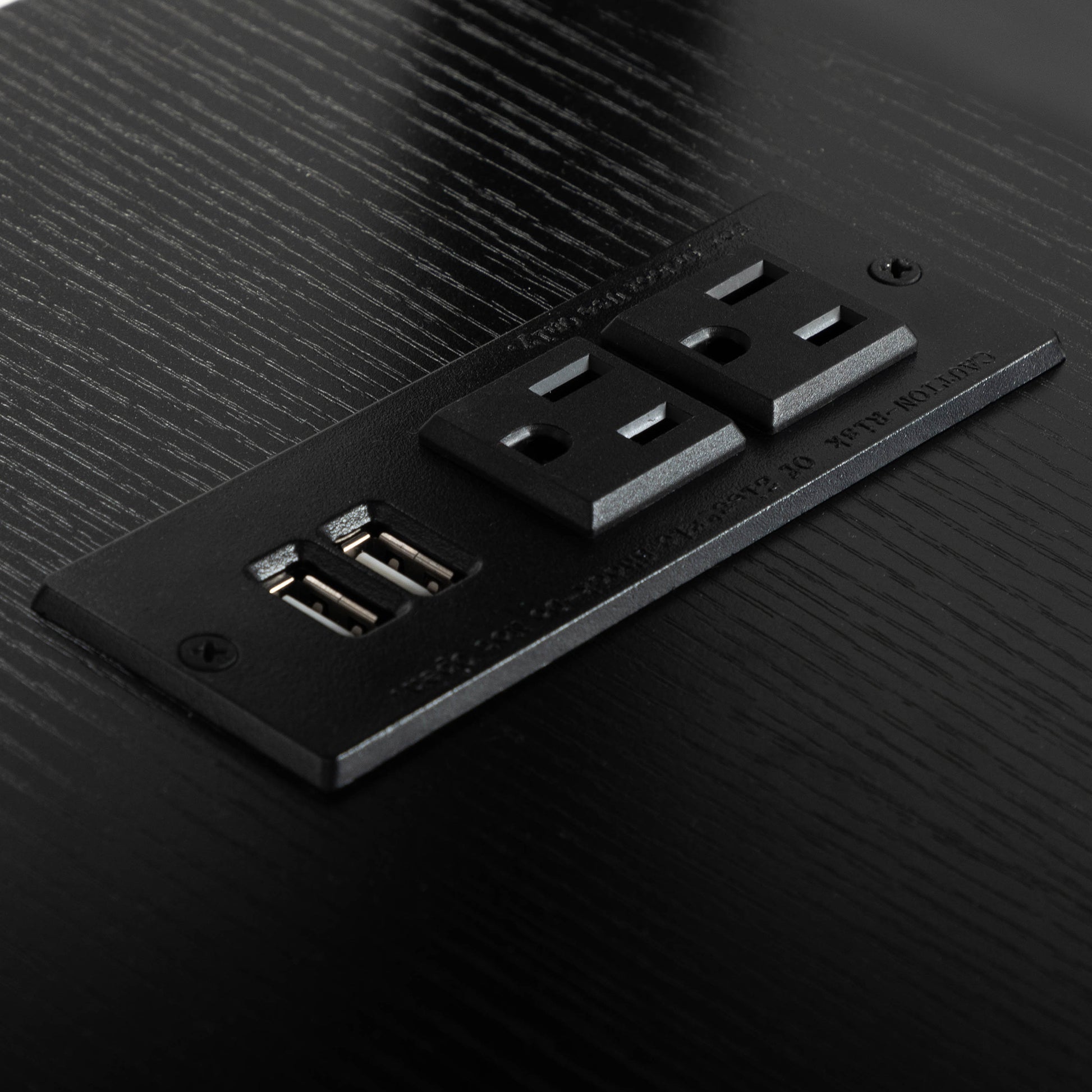 Black power strip with two outlets and two USB ports
