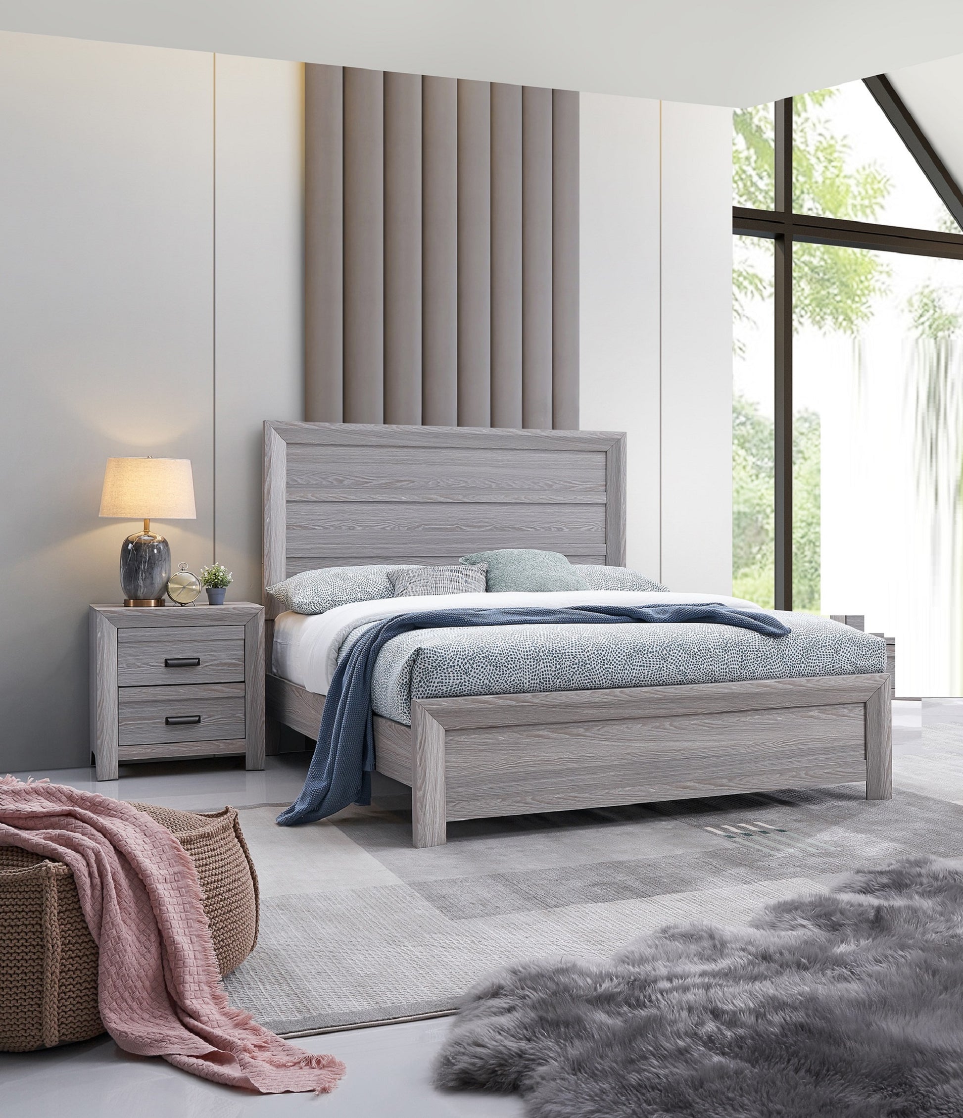 Modern gray wood bed frame with textured bedding and a blue throw