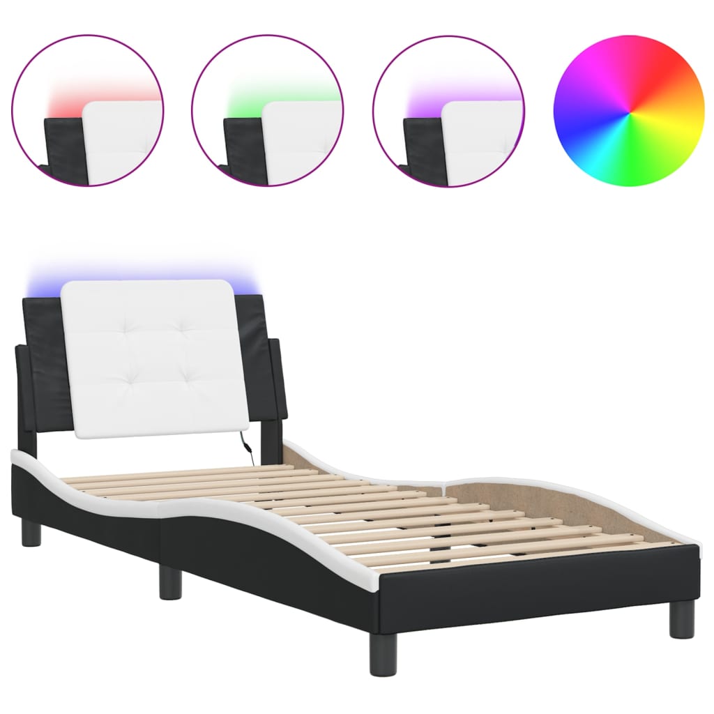 Closeup of black upholstered bed frame side with wooden slats and a black cylindrical leg
