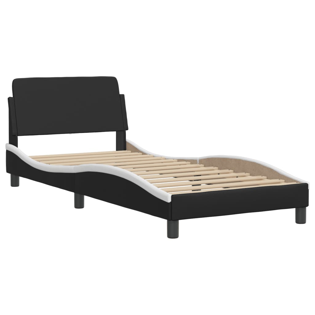 Black and white upholstered adjustable bed frame with slatted base
