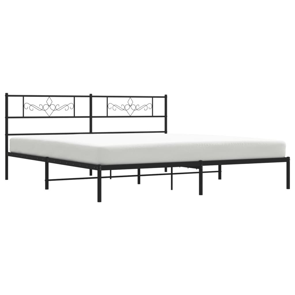 Black metal bed frame with ornate headboard detail