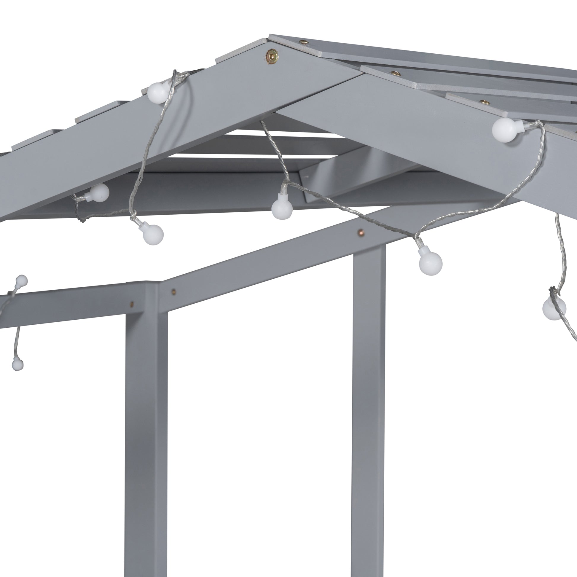 Gray wooden canopy bed frame with delicate string lights