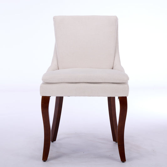 Cream upholstered accent chair with dark wood legs