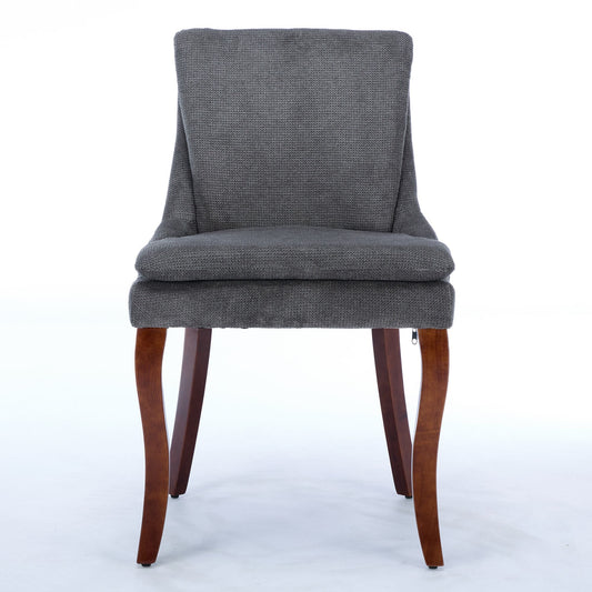 Gray upholstered dining chair with curved wooden legs
