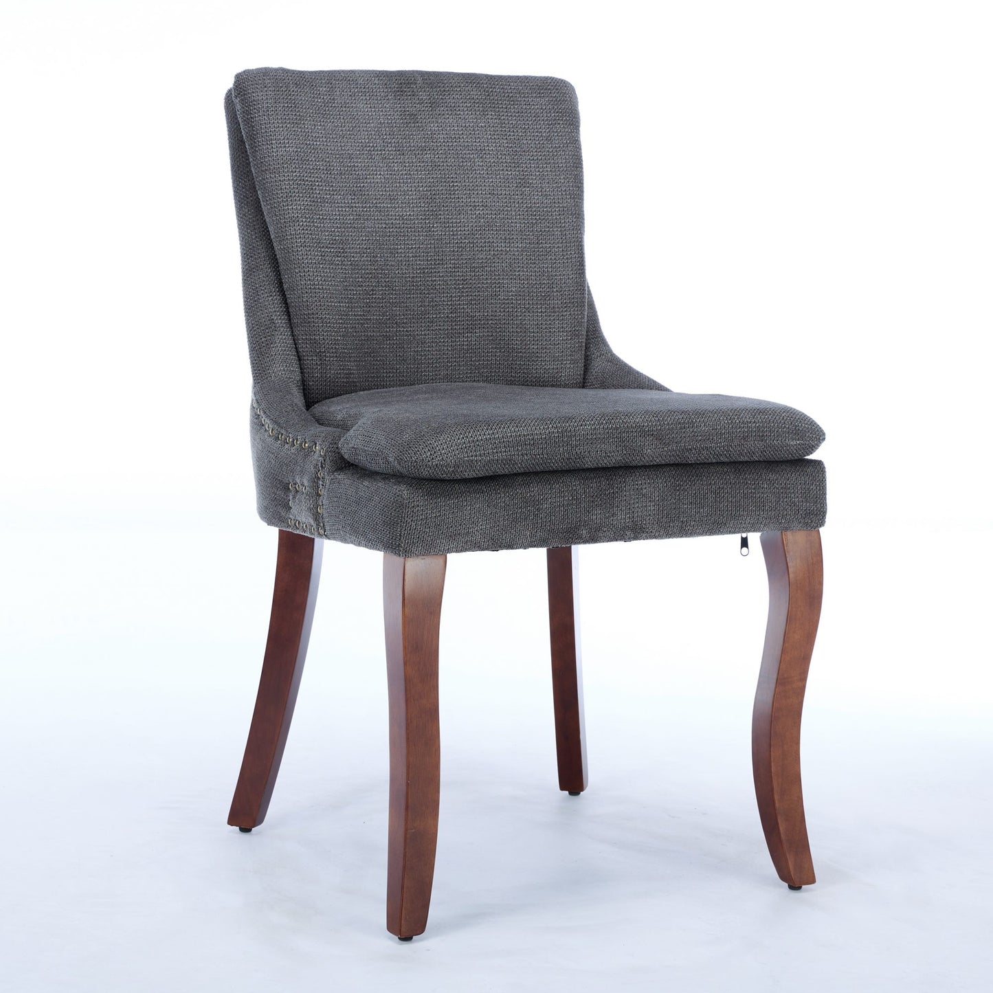 Dark gray upholstered dining chair with nailhead trim and curved wooden legs