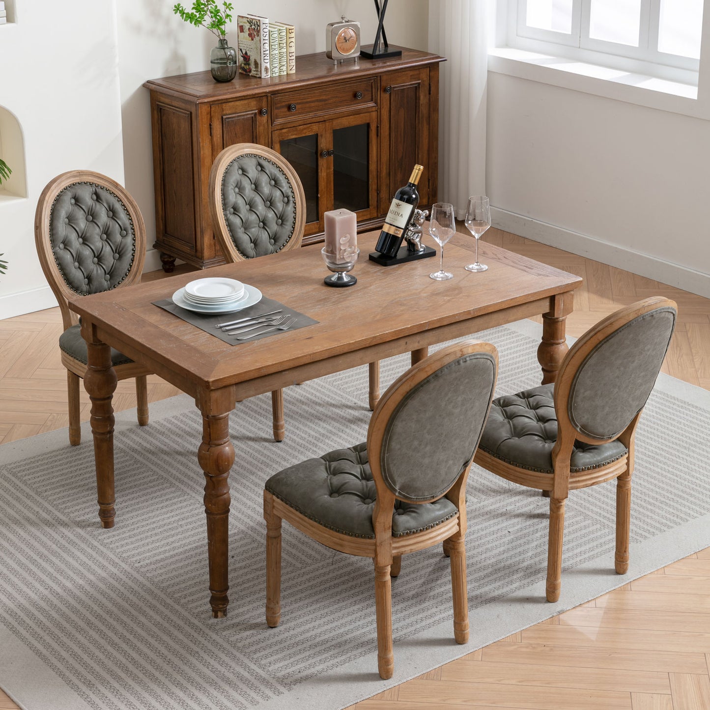 Four grey tufted upholstered dining chairs around a rustic wooden dining table