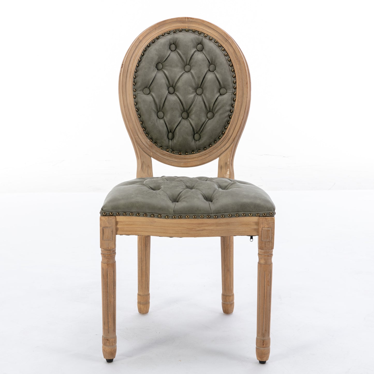 Grey tufted dining chair with wooden frame and brass nailhead trim