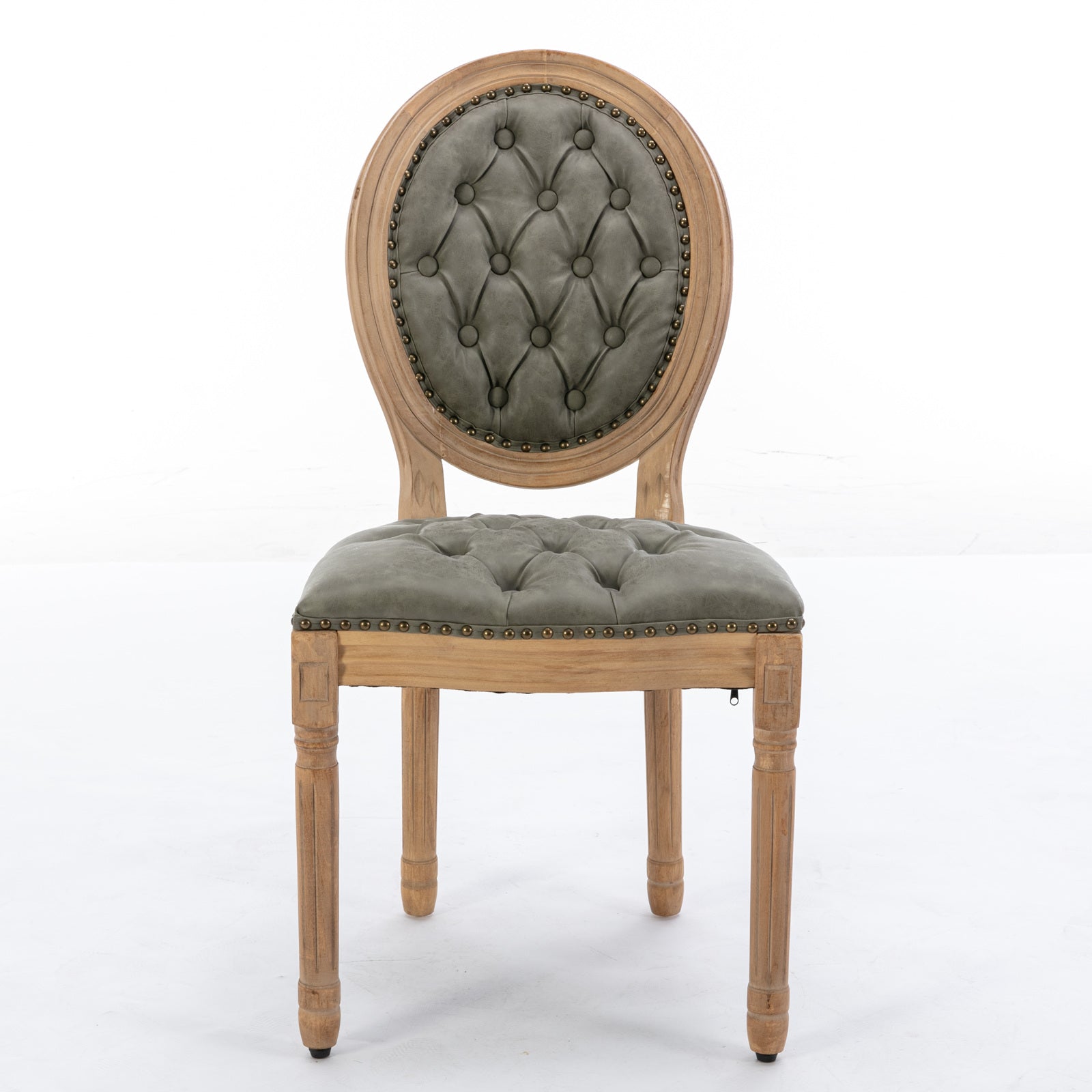 Grey tufted dining chair with wooden frame and brass nailhead trim