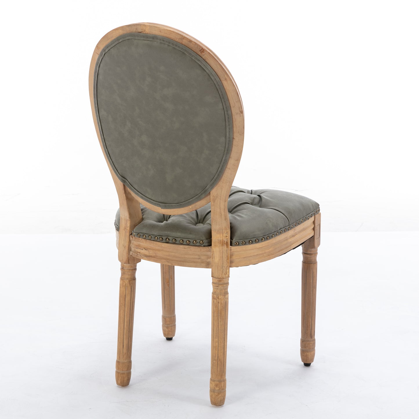 Tufted grey upholstered accent chair with distressed wooden frame and carved legs