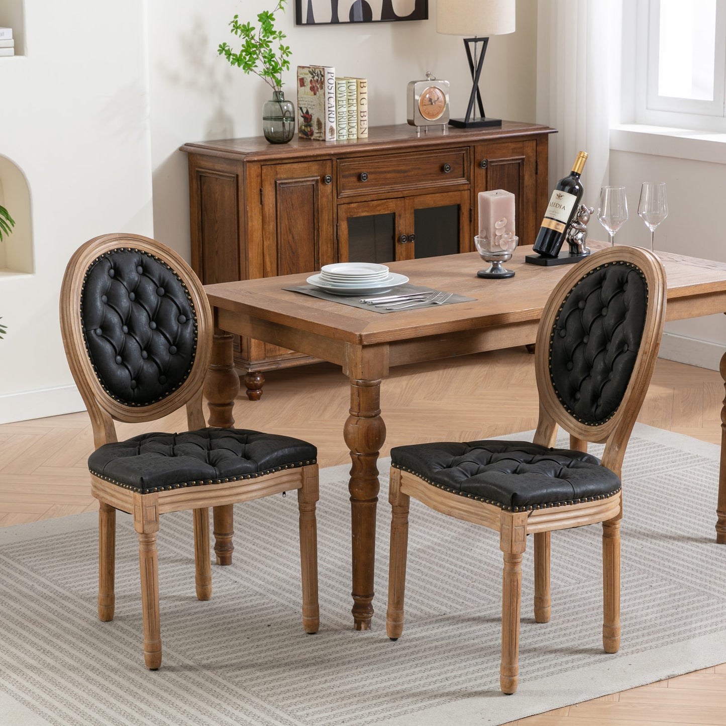 Tufted black faux leather dining chair with ornate wooden frame