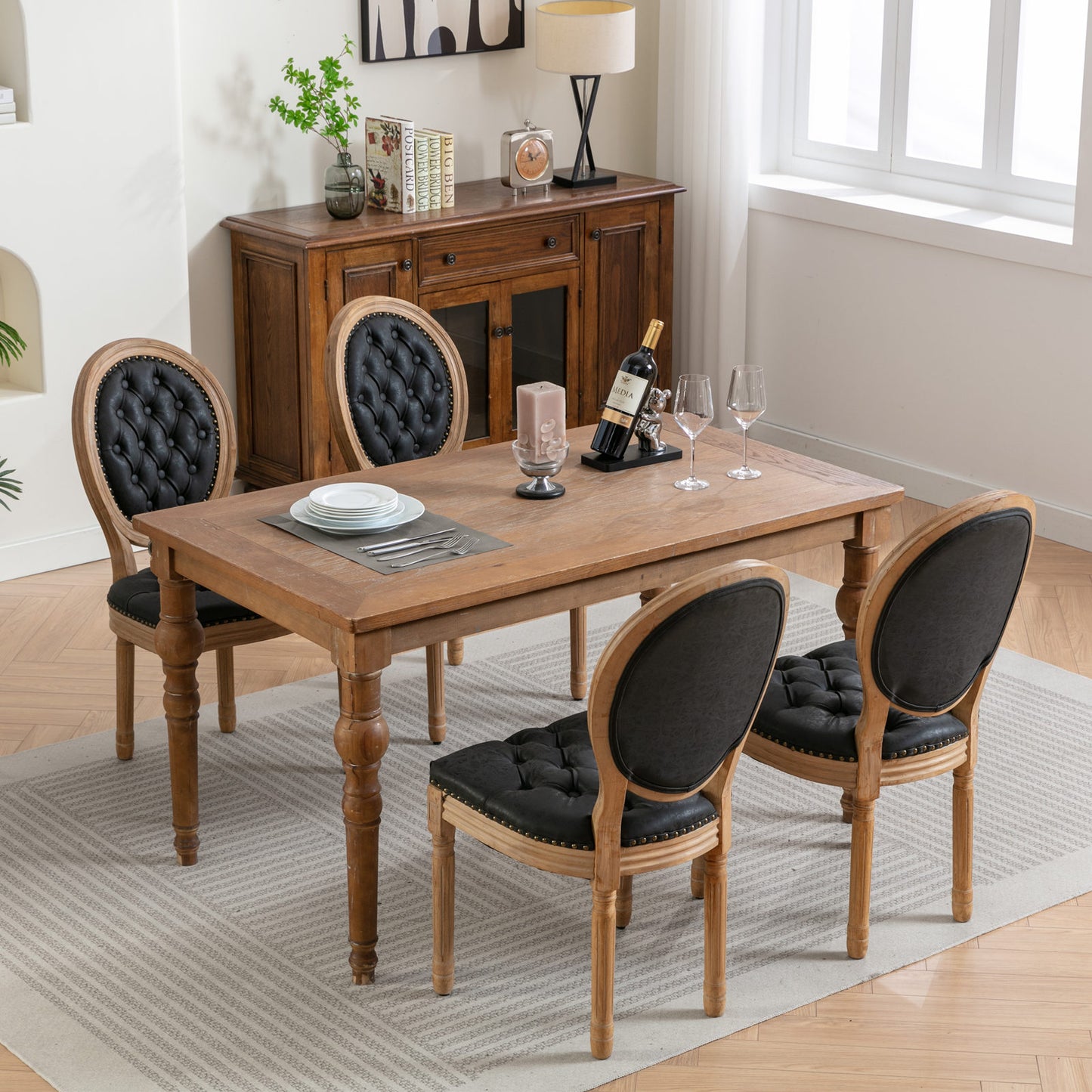 Rustic oak dining table with four tufted black faux leather chairs