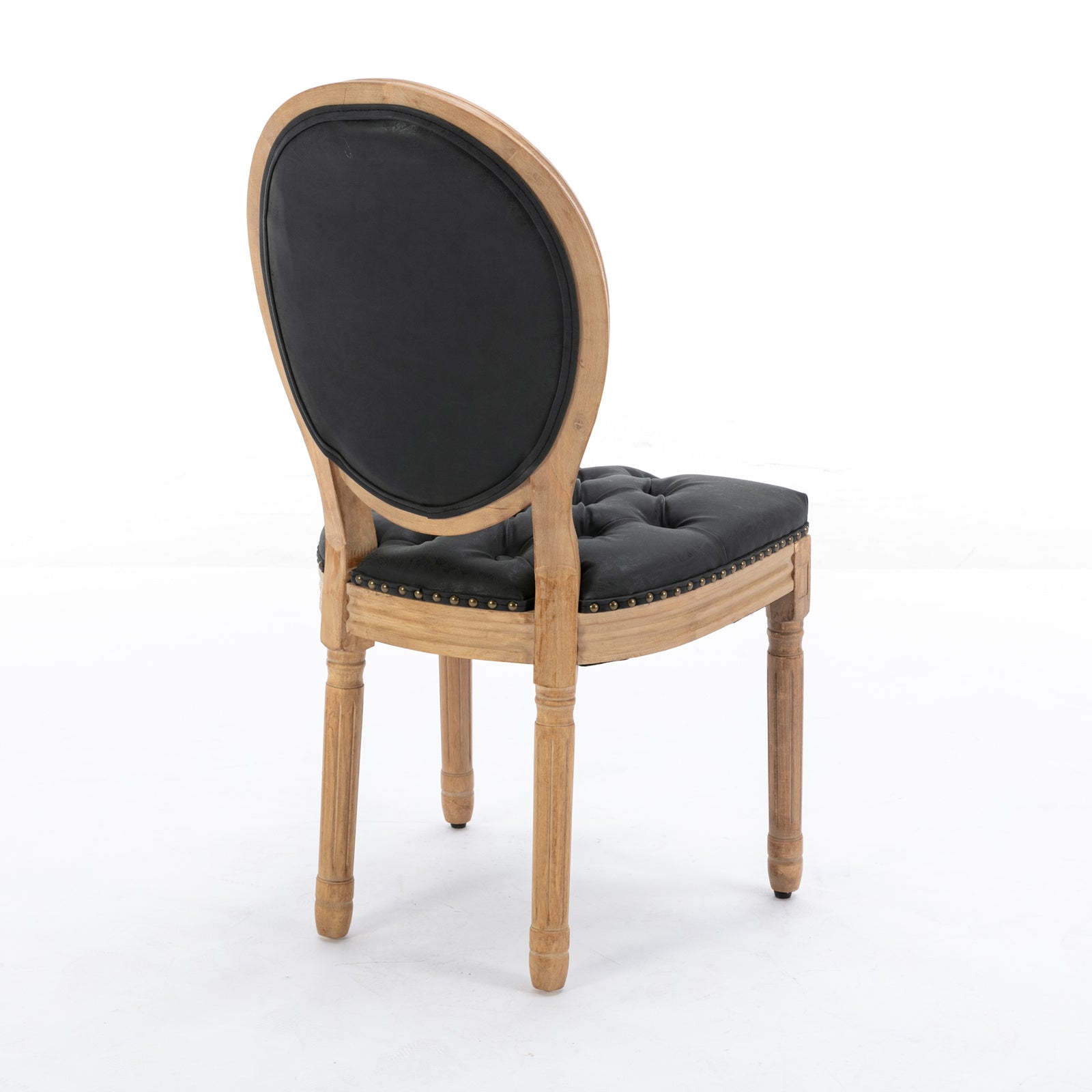 Tufted black leather seat and oval backrest on a rustic wooden accent chair