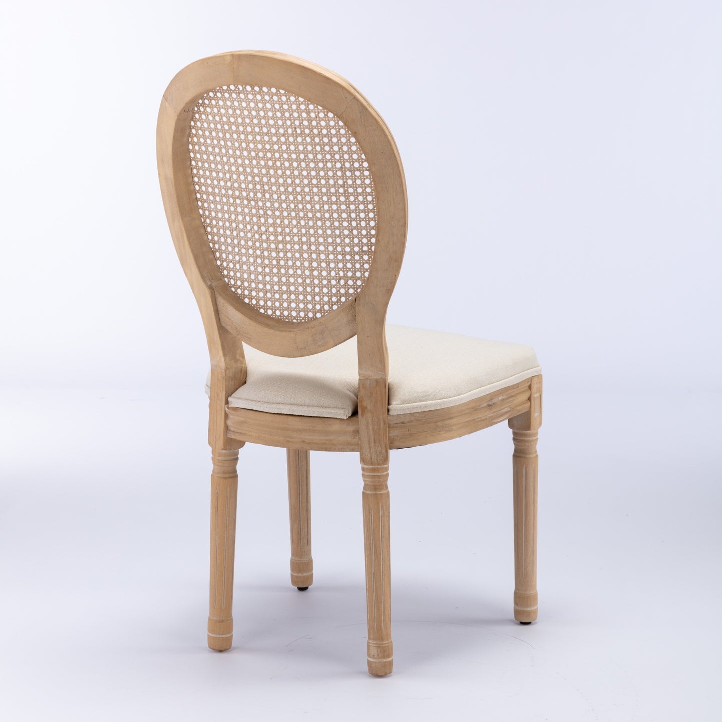Light wood cane back dining chair with cream upholstered seat
