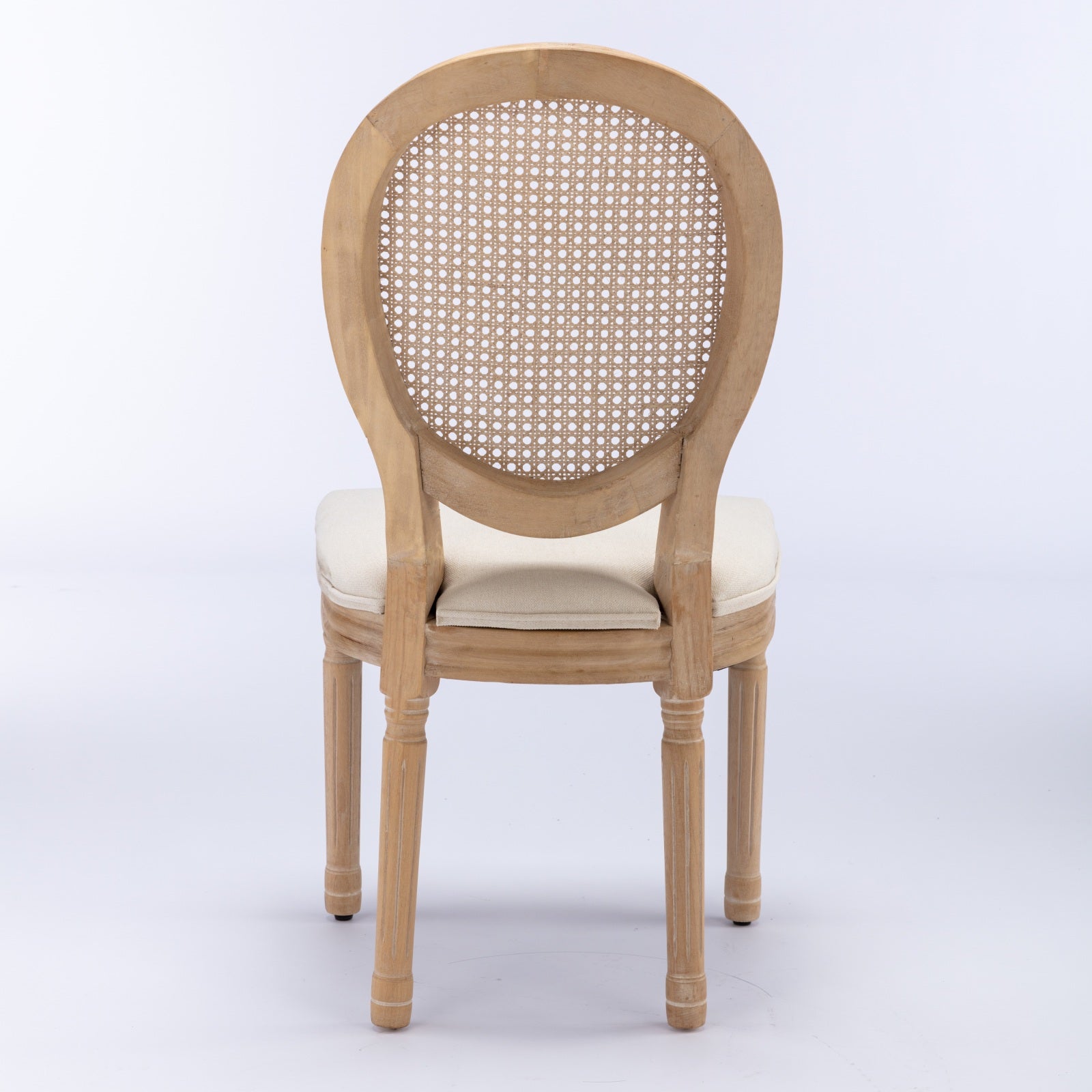 Natural wood armchair with cane back and beige upholstered seat