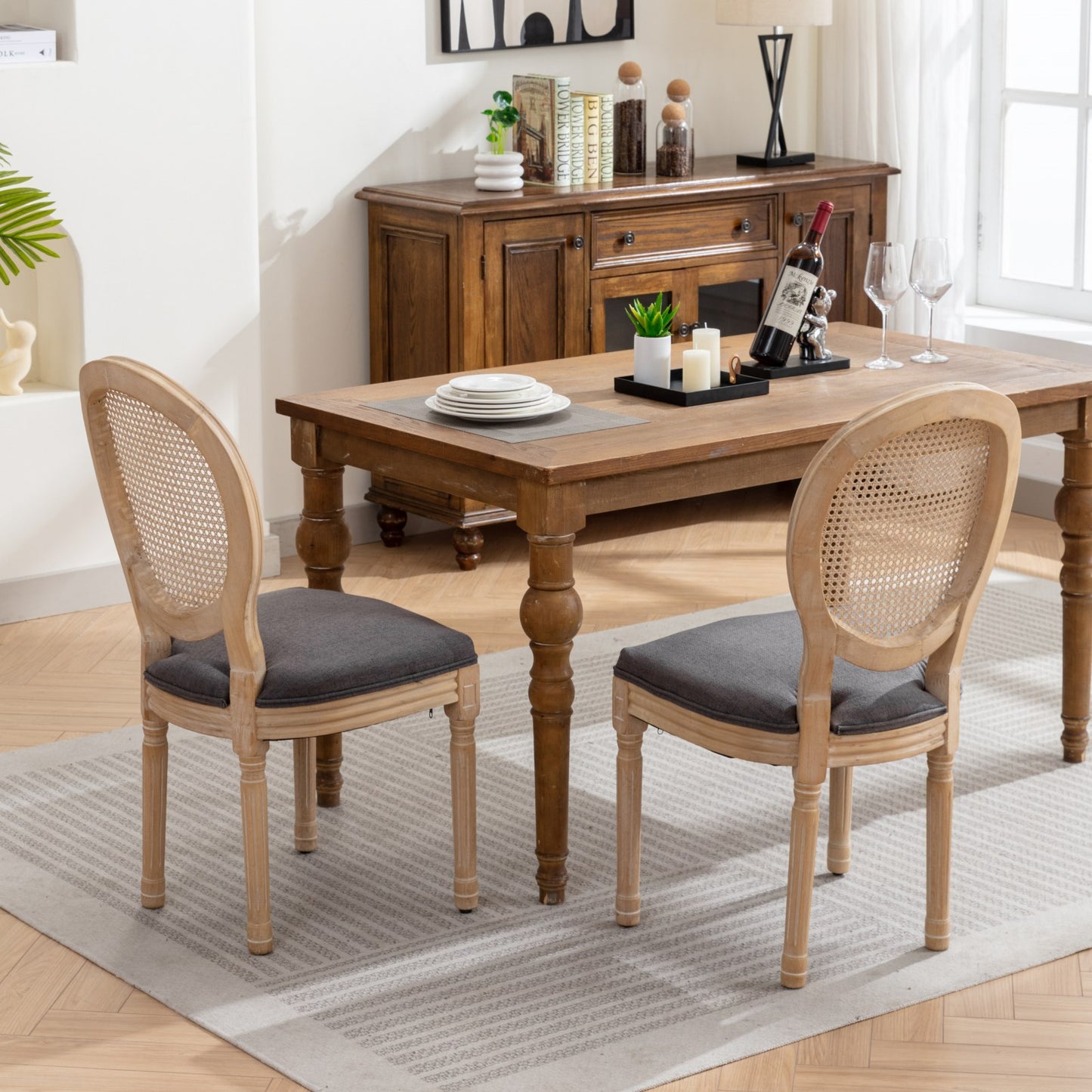 Light oak cane back dining chair with dark gray upholstered seat