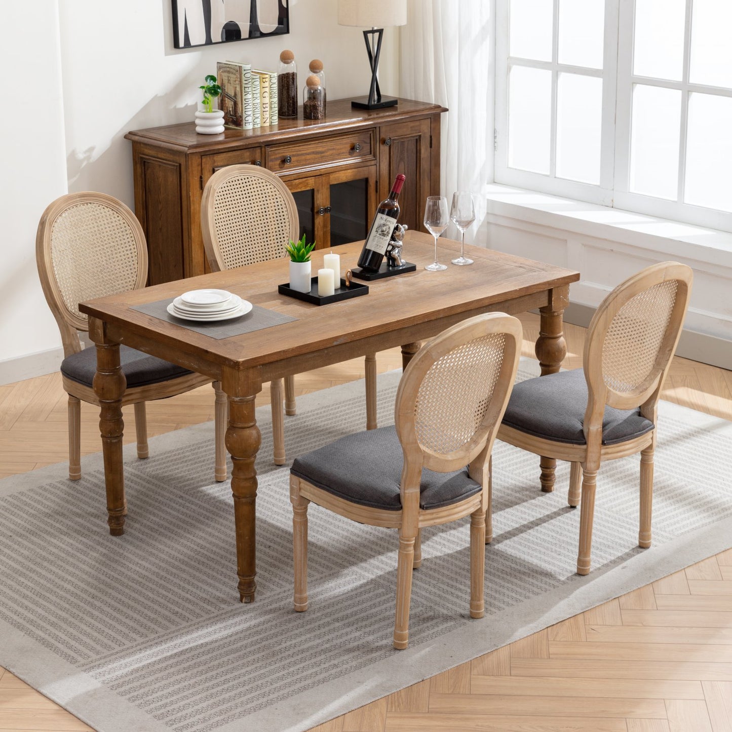 Rustic oak dining table with four caneback chairs