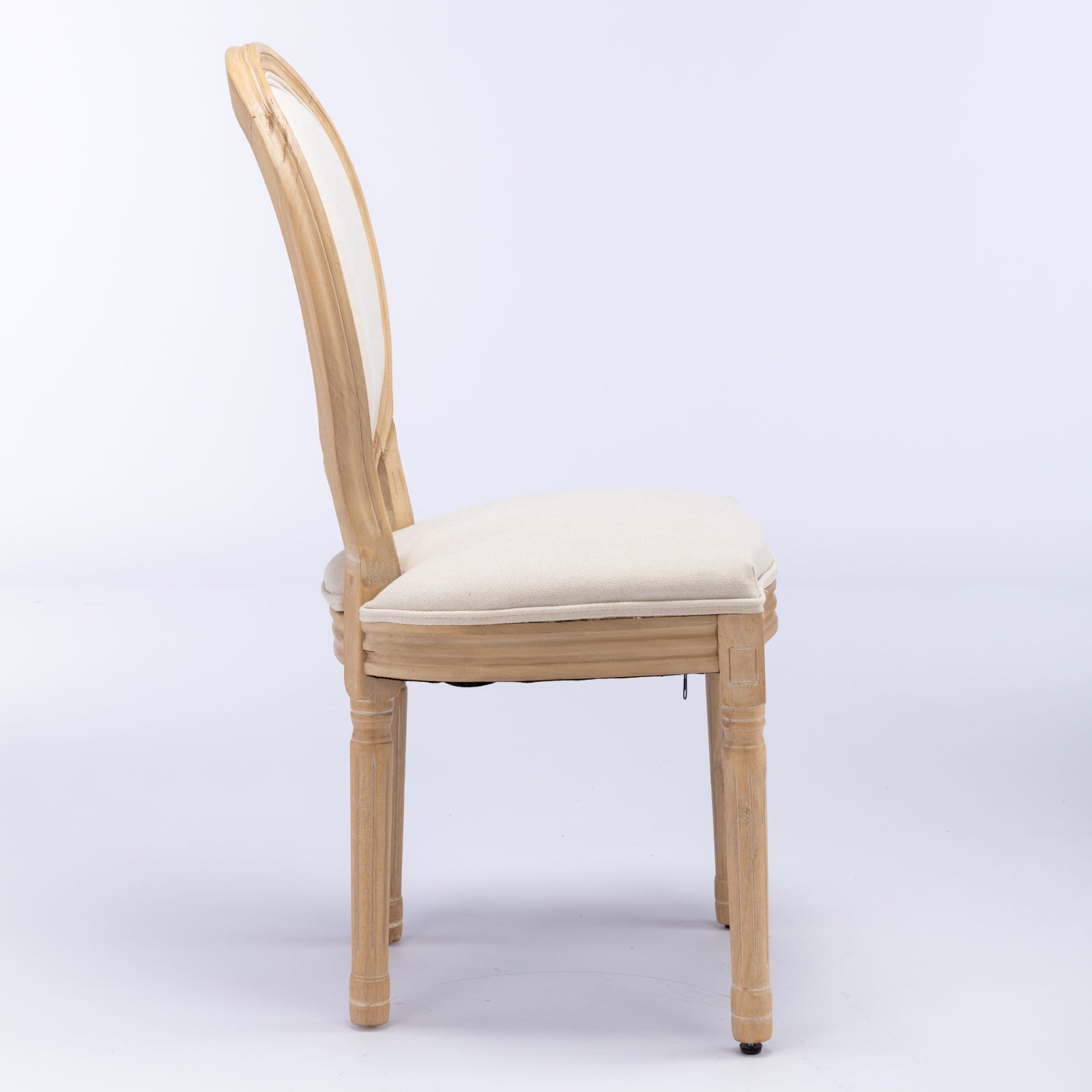 Elegant farmhouse dining chair with light wood frame and cream upholstered seat and back