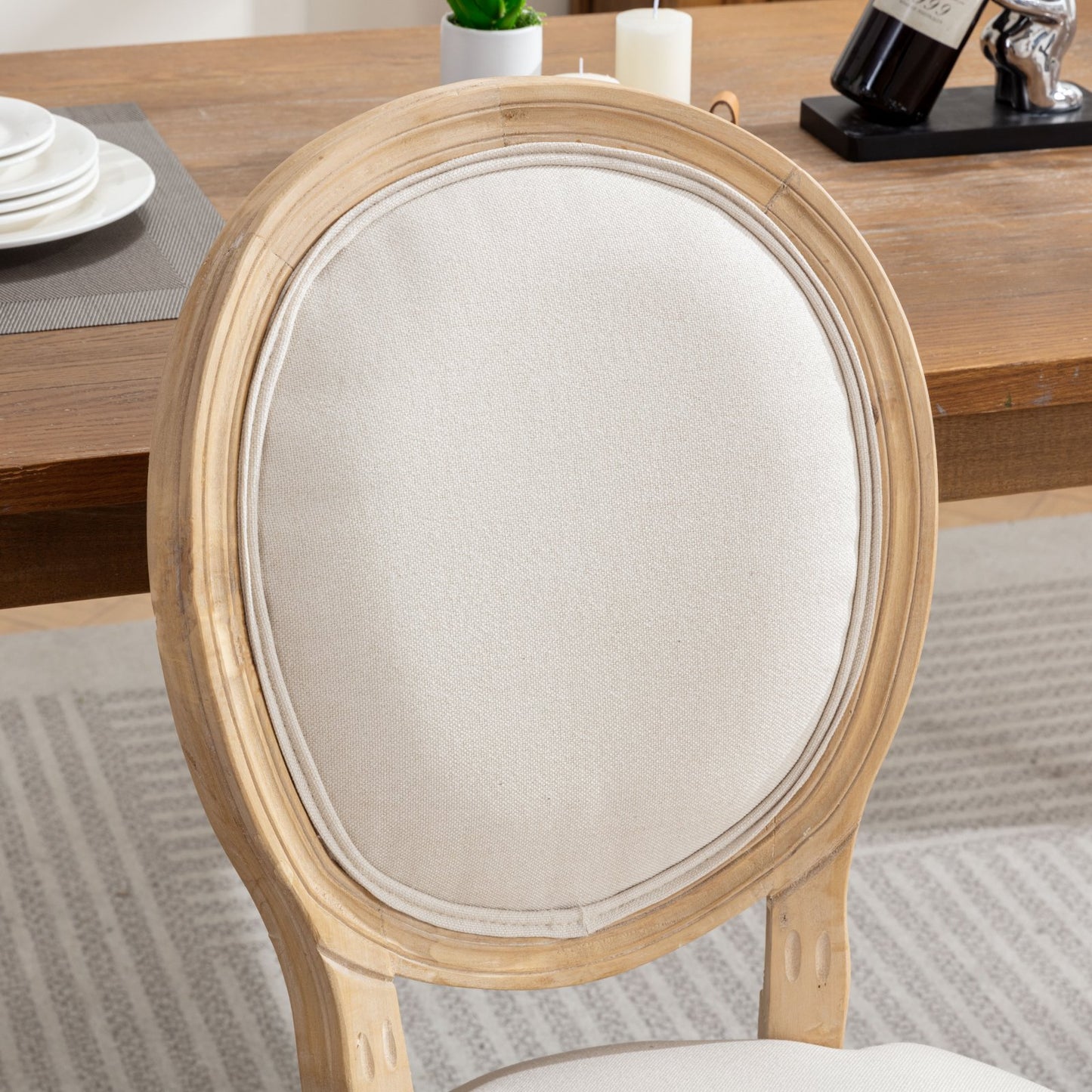 Distressed wood oval back dining chair with cream upholstered seat