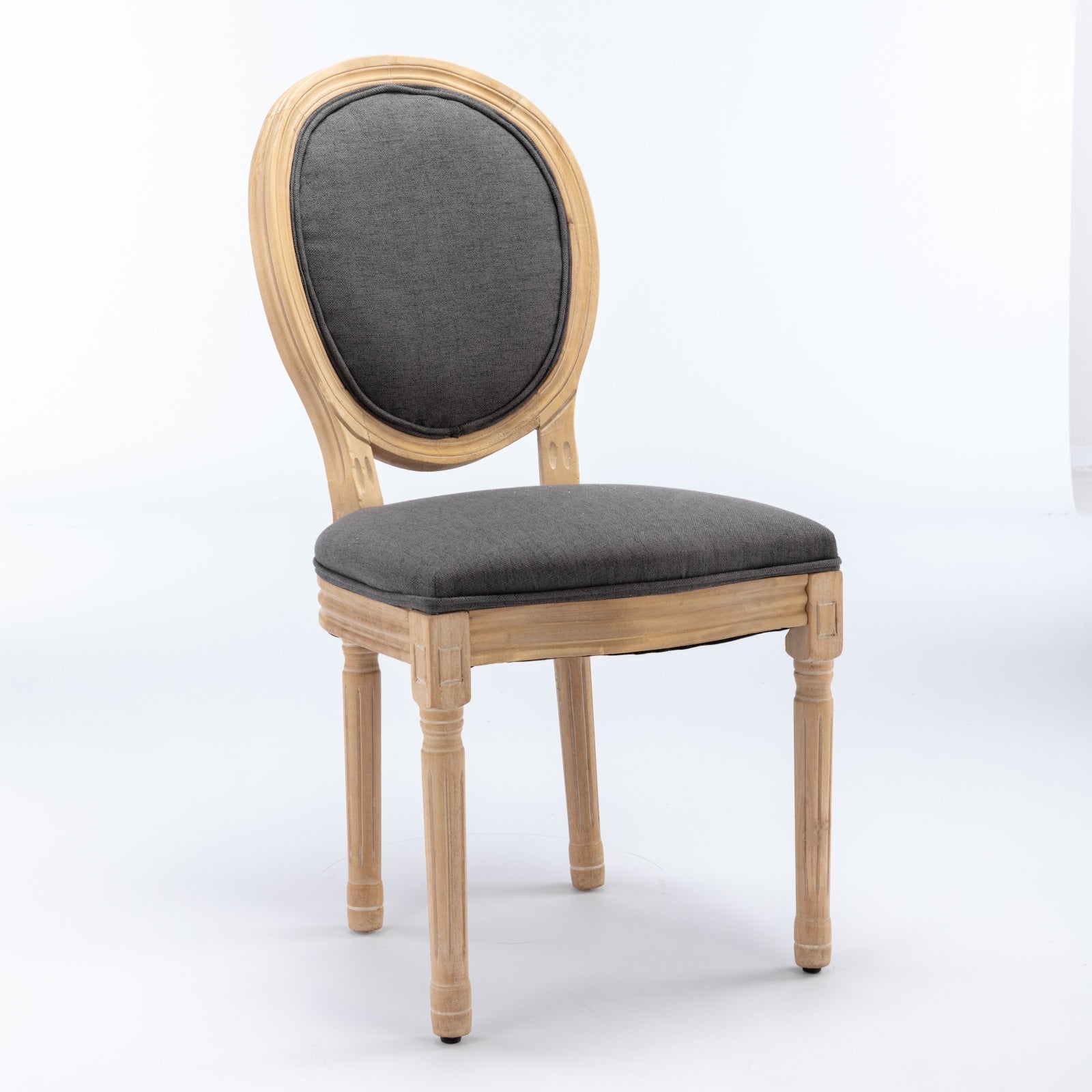 French country side chair with dark gray upholstered seat and back on a light wood frame