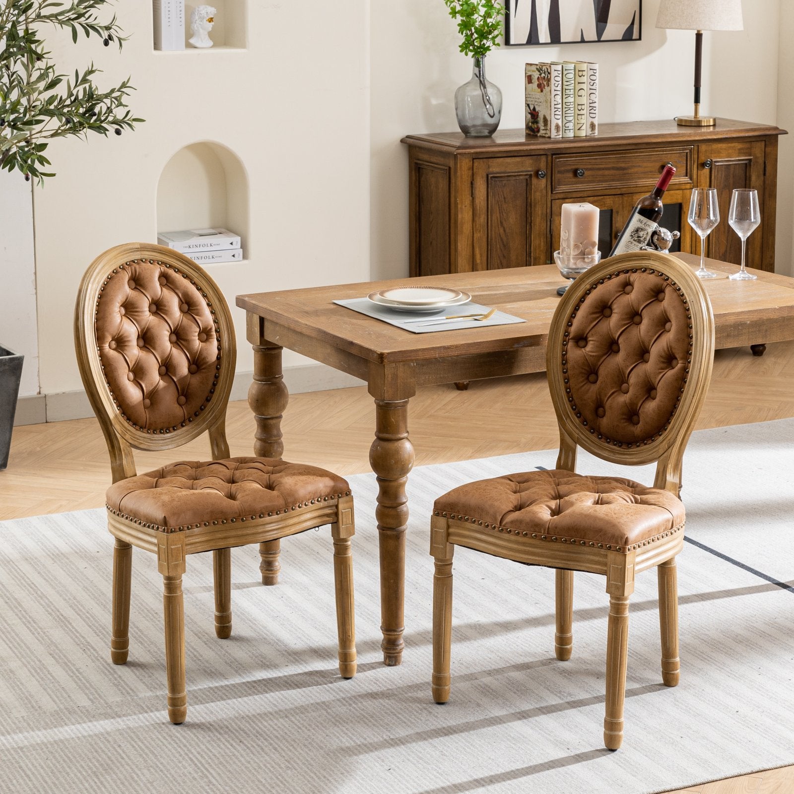 Tufted brown leather dining chair with wooden frame and nailhead trim