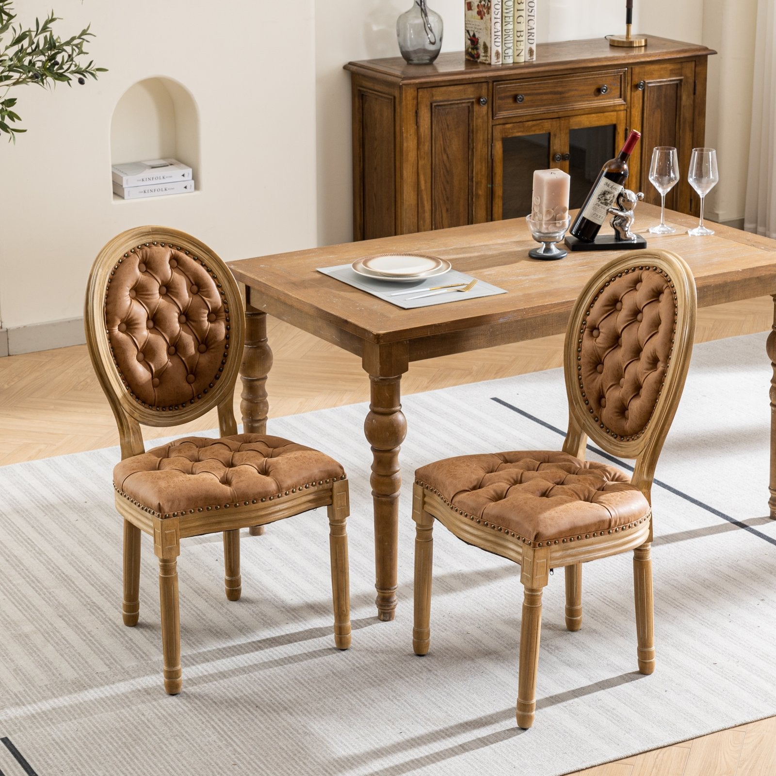 Brown tufted upholstered dining chairs with carved wooden frames