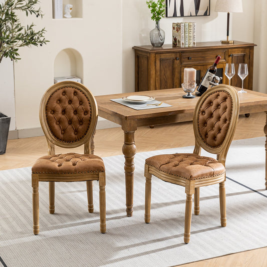 Tufted brown leather dining chair with ornate wooden frame