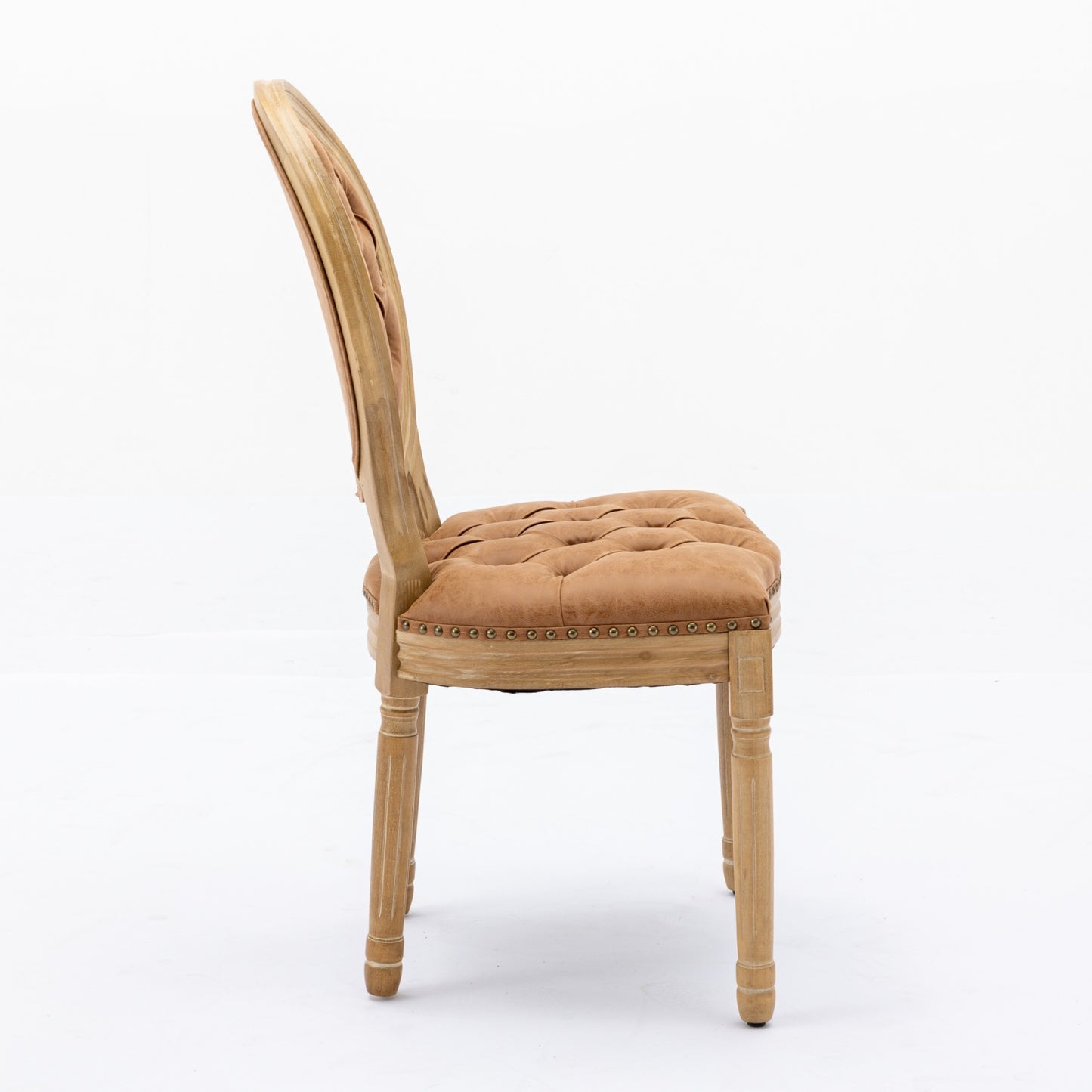 Tufted brown leather armchair with carved wood frame