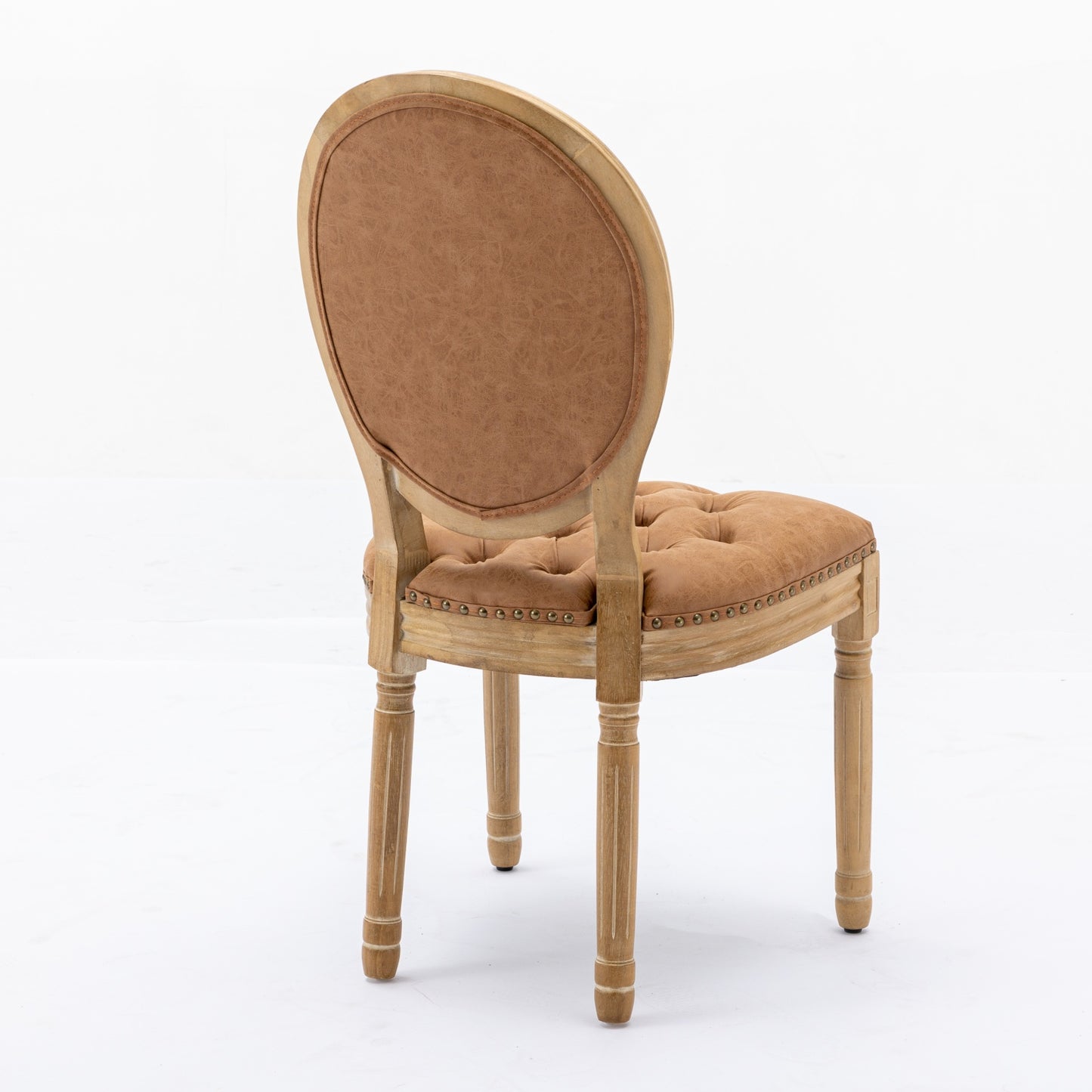 Tan upholstered chair with tufted seat and carved wooden legs