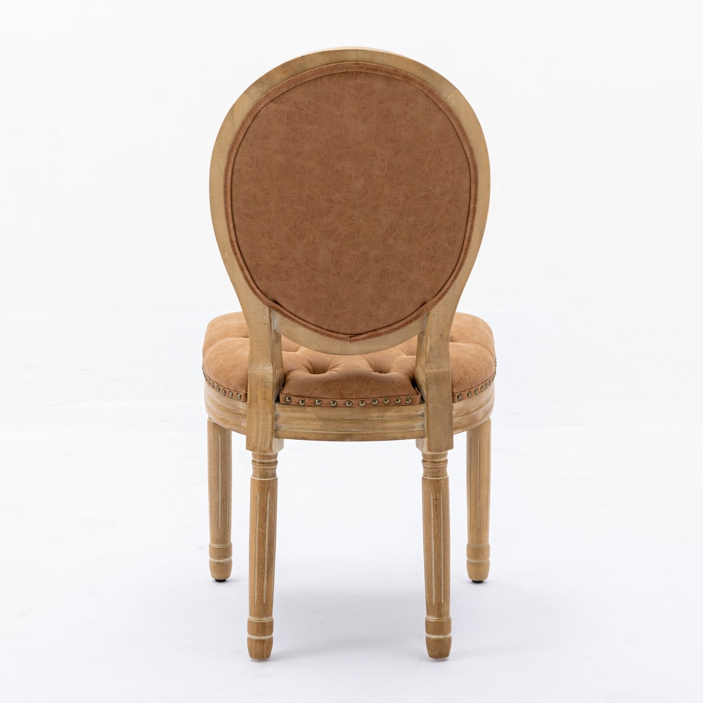 Tufted camel brown faux leather armchair with distressed wood frame