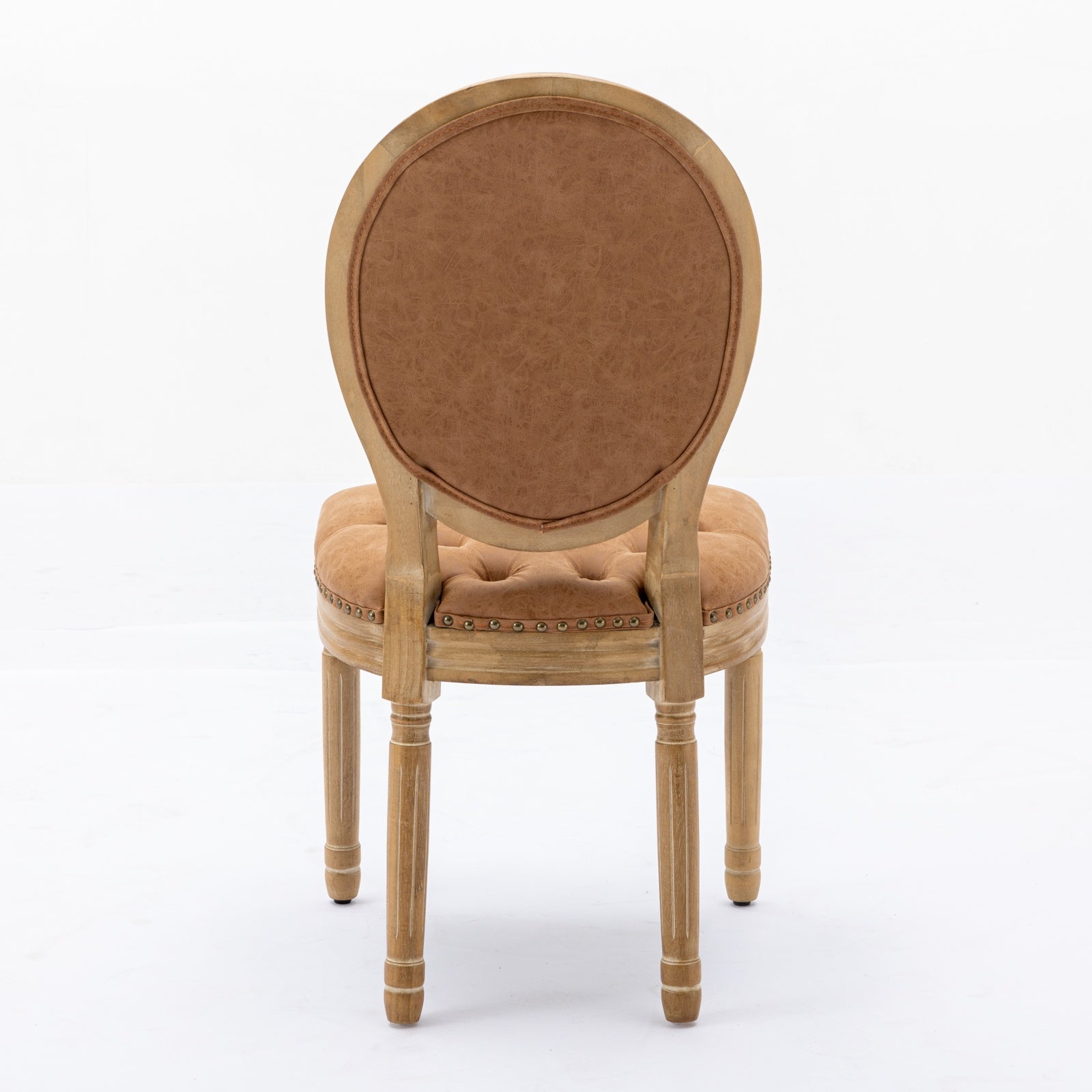 Tufted camel brown faux leather armchair with distressed wood frame
