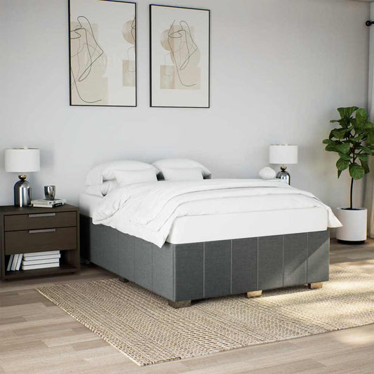 Modern grey divan bed with white linens and two pillows