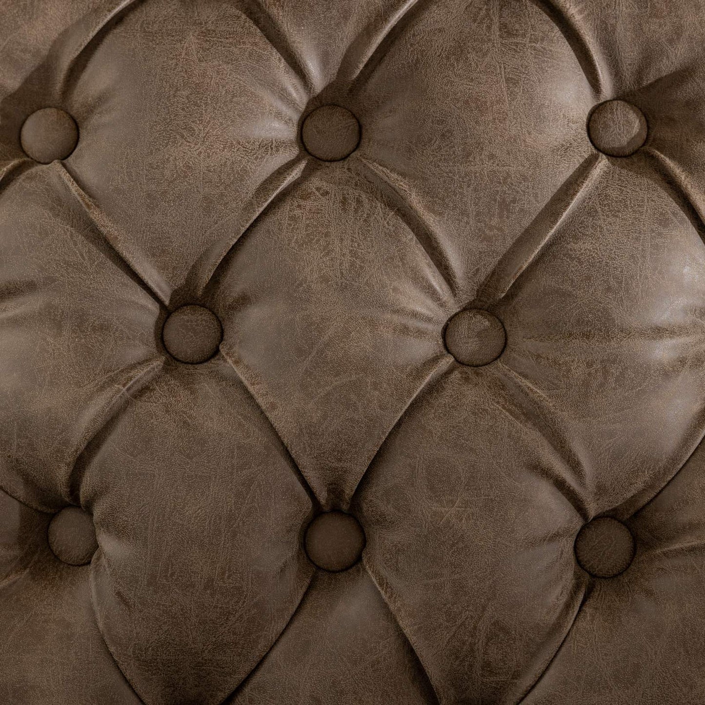 Brown faux leather tufted upholstery detail