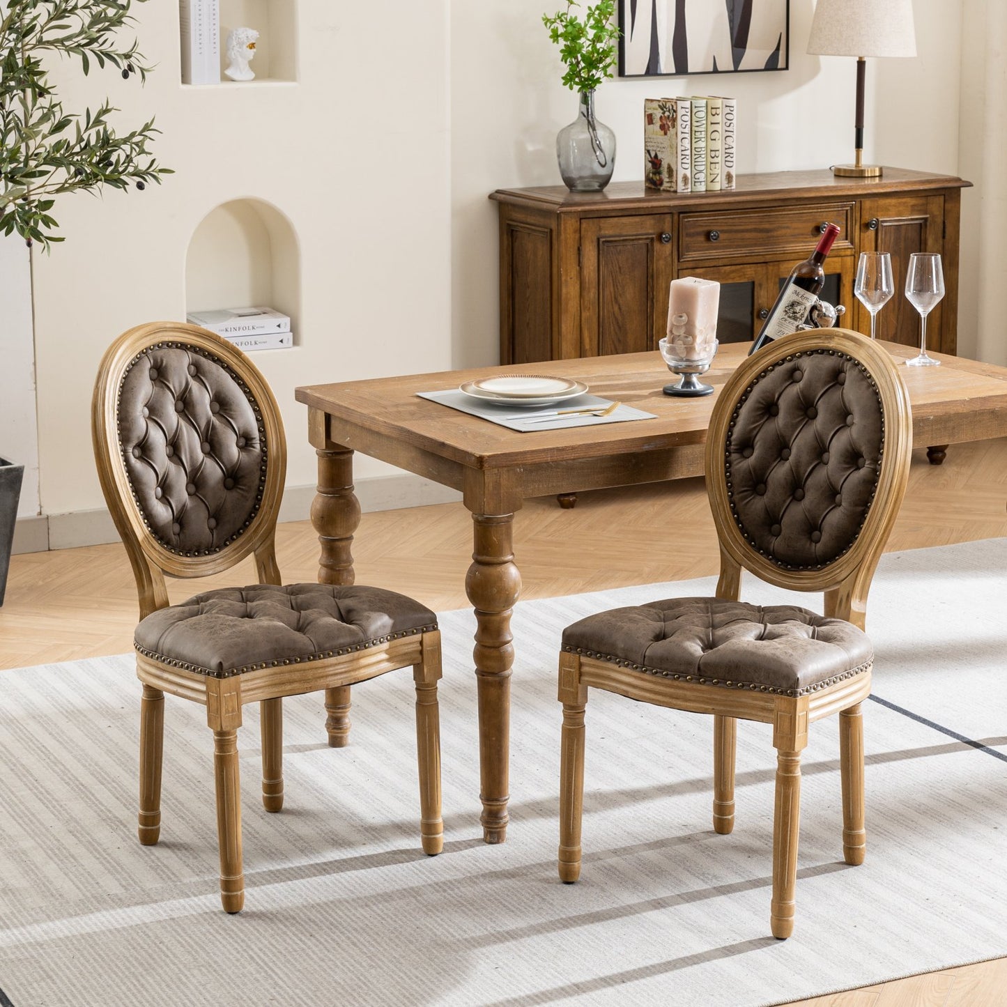 Tufted brown leather armchair with distressed wood frame