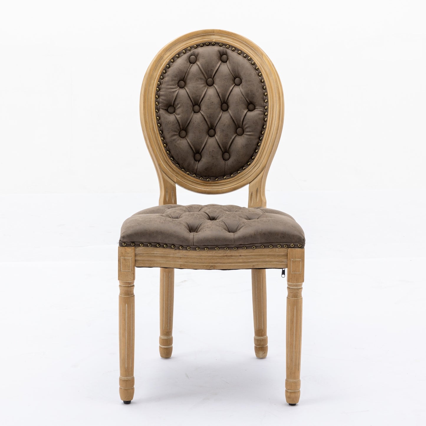 Tufted brown accent chair with distressed wood frame and brass nailhead trim